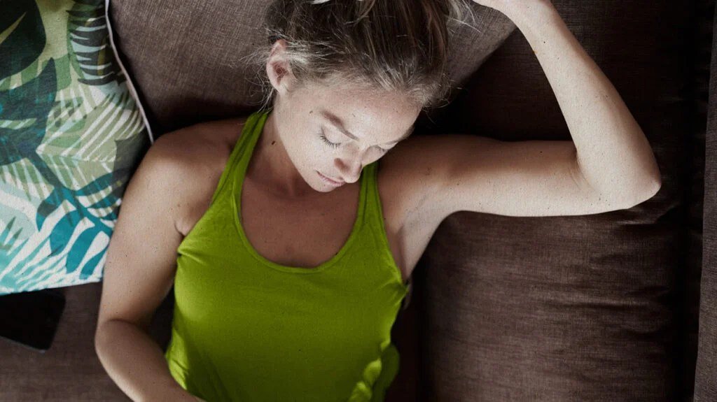 A person lying on a couch 1