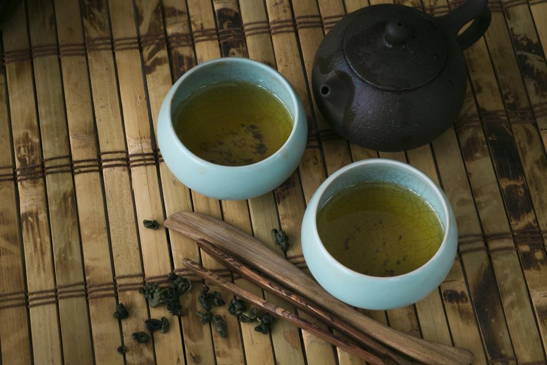 pot and cups of green tea