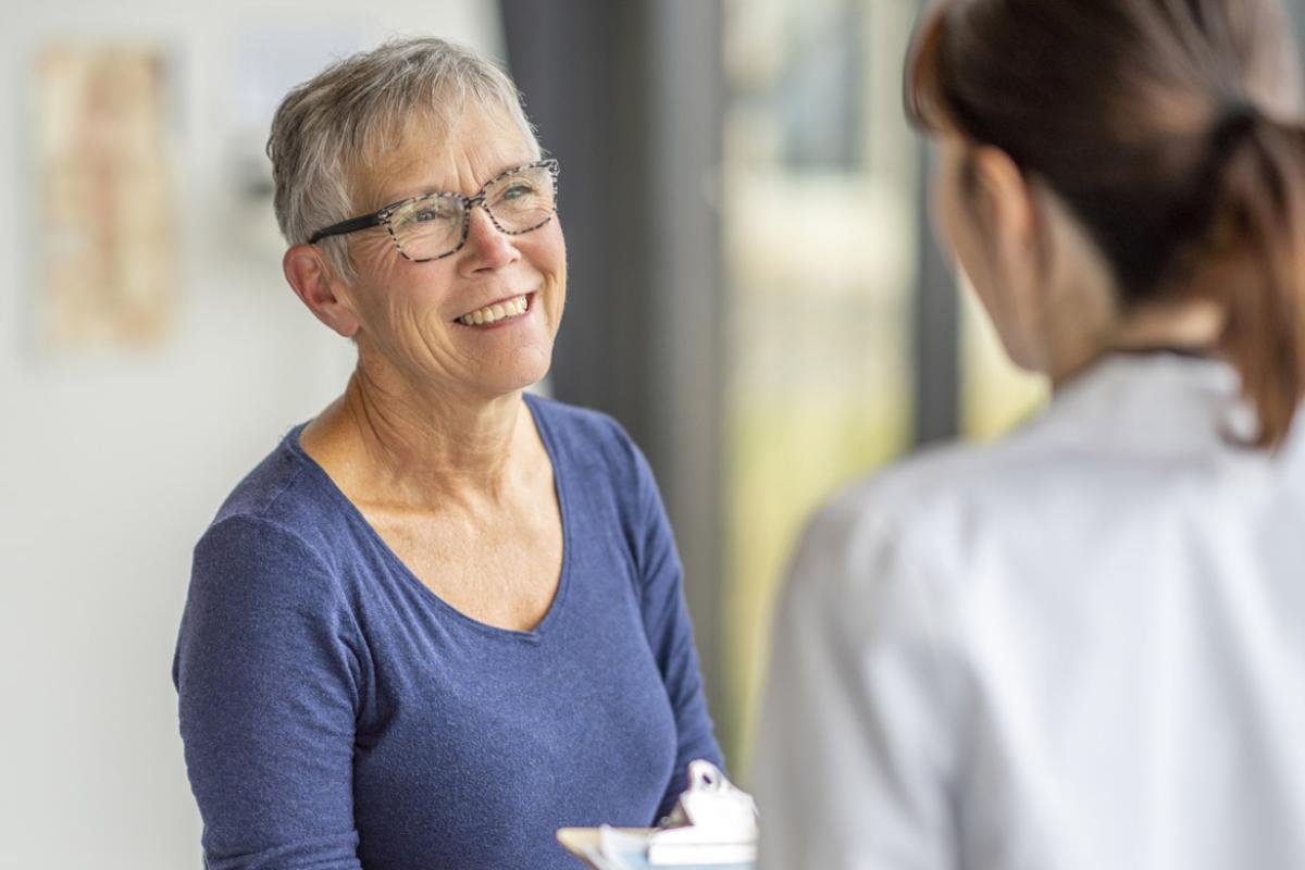 Older adult speaks with physician