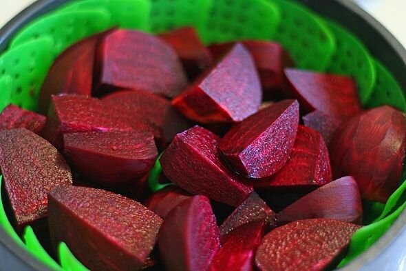 Peeled beets in steamer basket